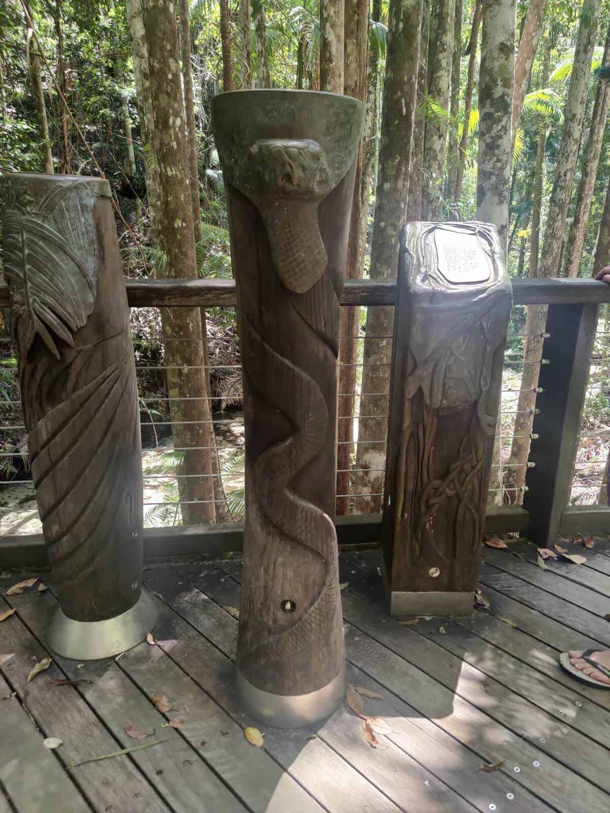 wooden carved sculptures at central station fraser island