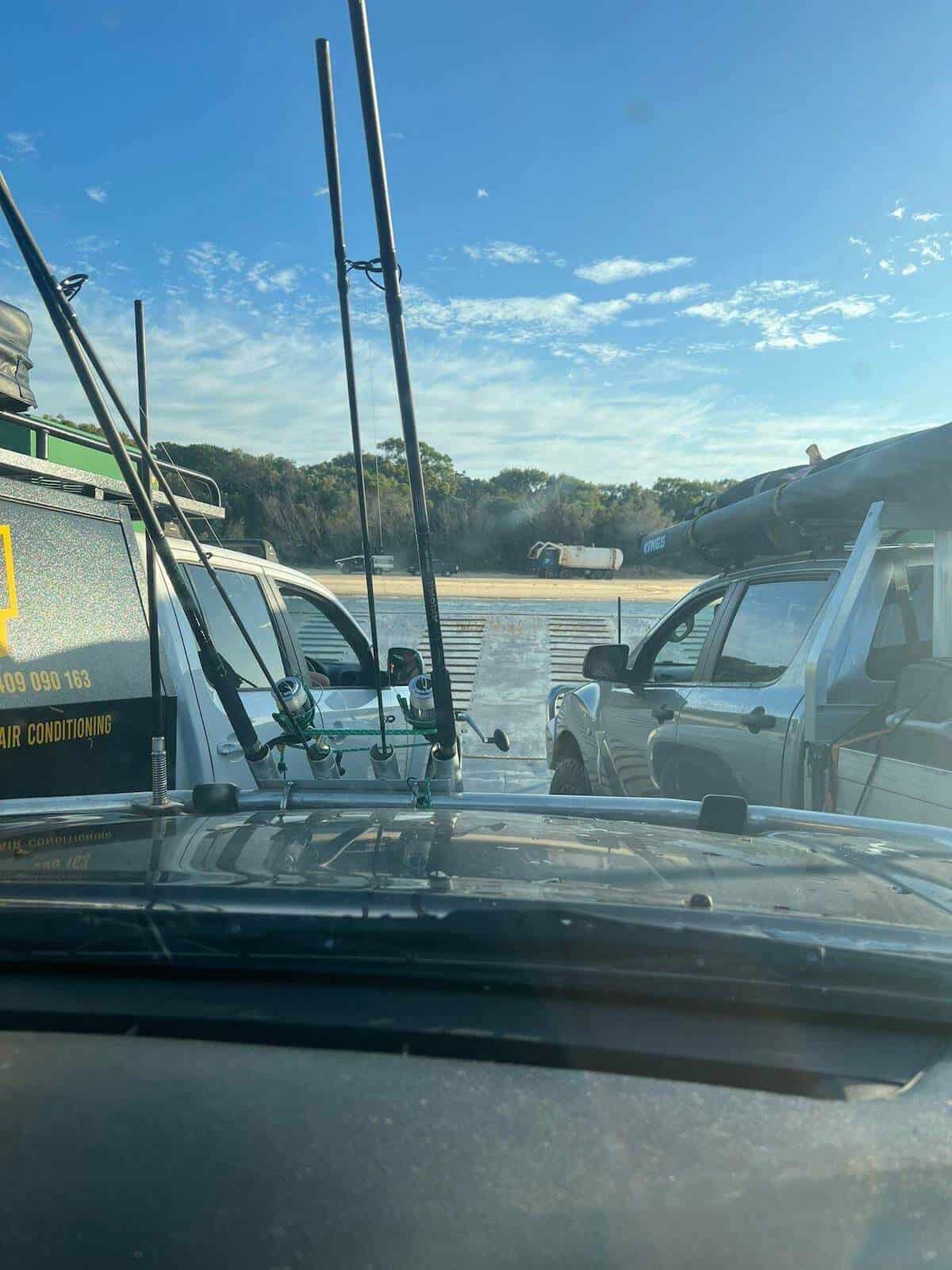 preparing to drive car off ferry onto fraser island k'gari