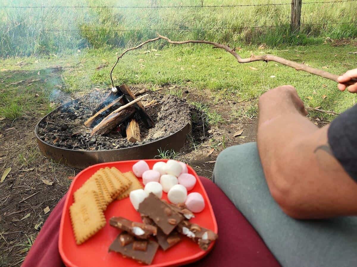 preparing to make smores at the campfire