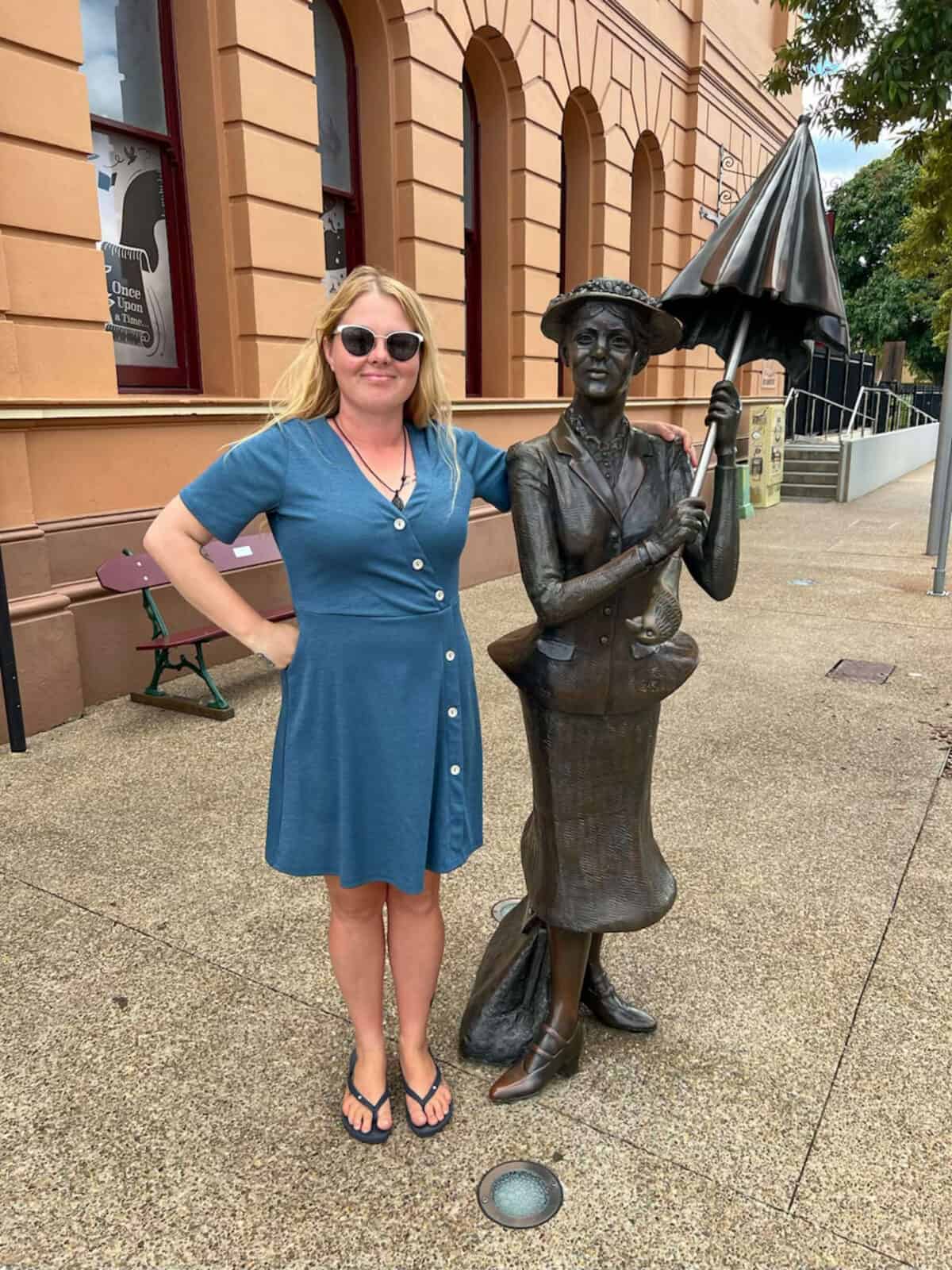 Shannon standing with a statue of Mary Poppins